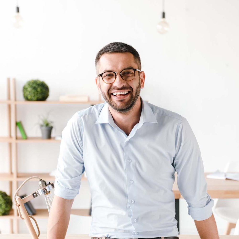 happy-portrait-of-businesslike-man-wearing-white-s-Z7HX3UL.jpg