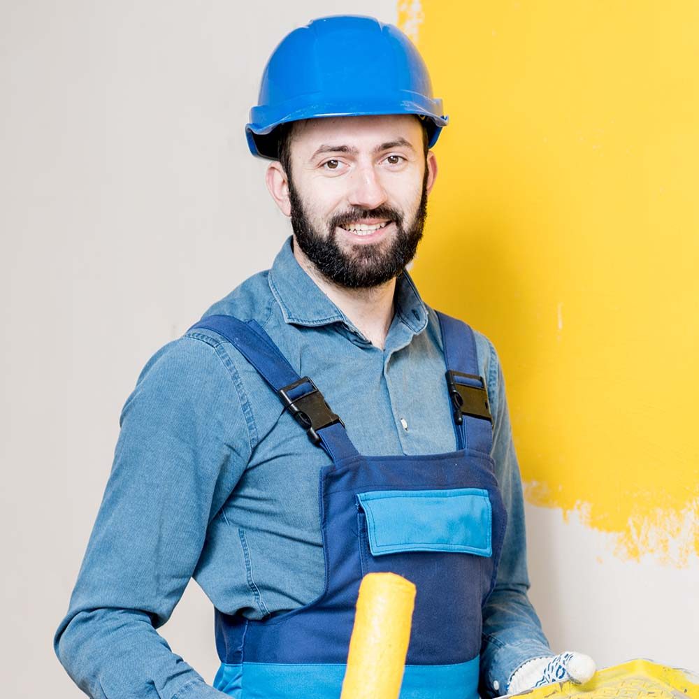 repairman-painting-wall-FNPRWQN.jpg